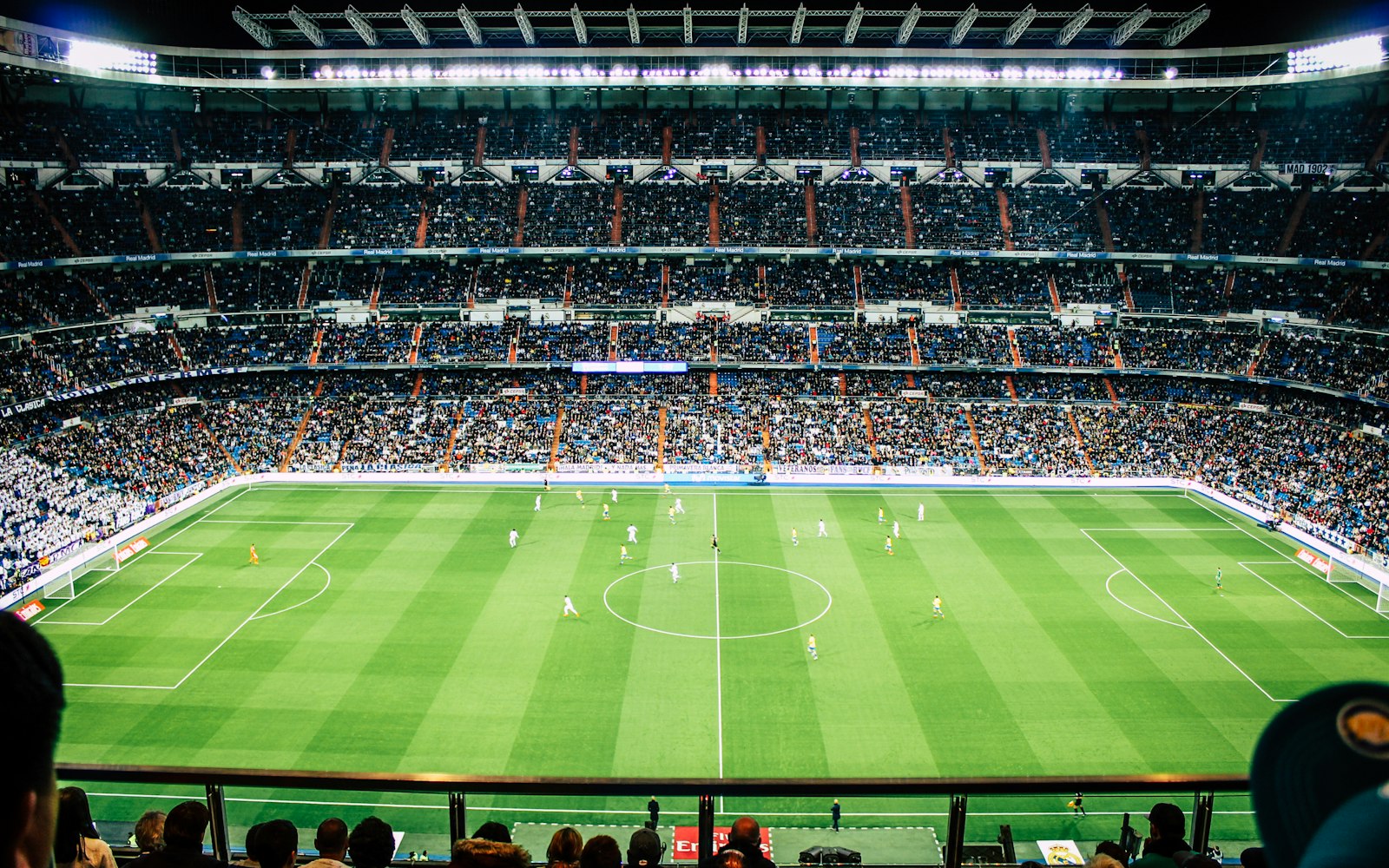 Stadium under floodlights on game night